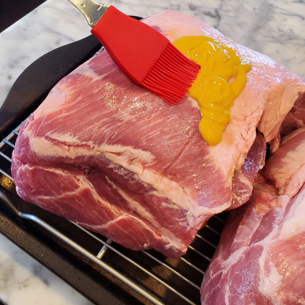 Raw pork butt prepared for smoking