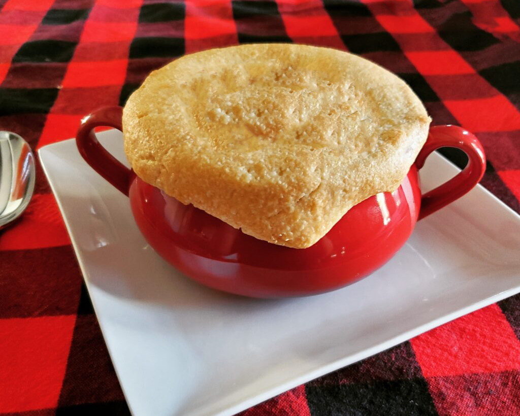 Individual turkey pot pies baked in ramekins with golden pie crust tops.