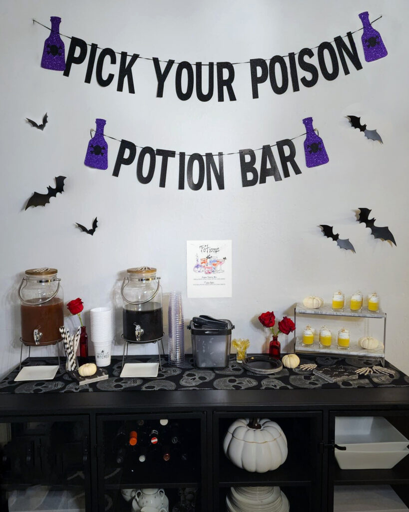 Black Magic Halloween potion bar with themed cocktails, skull glassware, and custom drink menu.