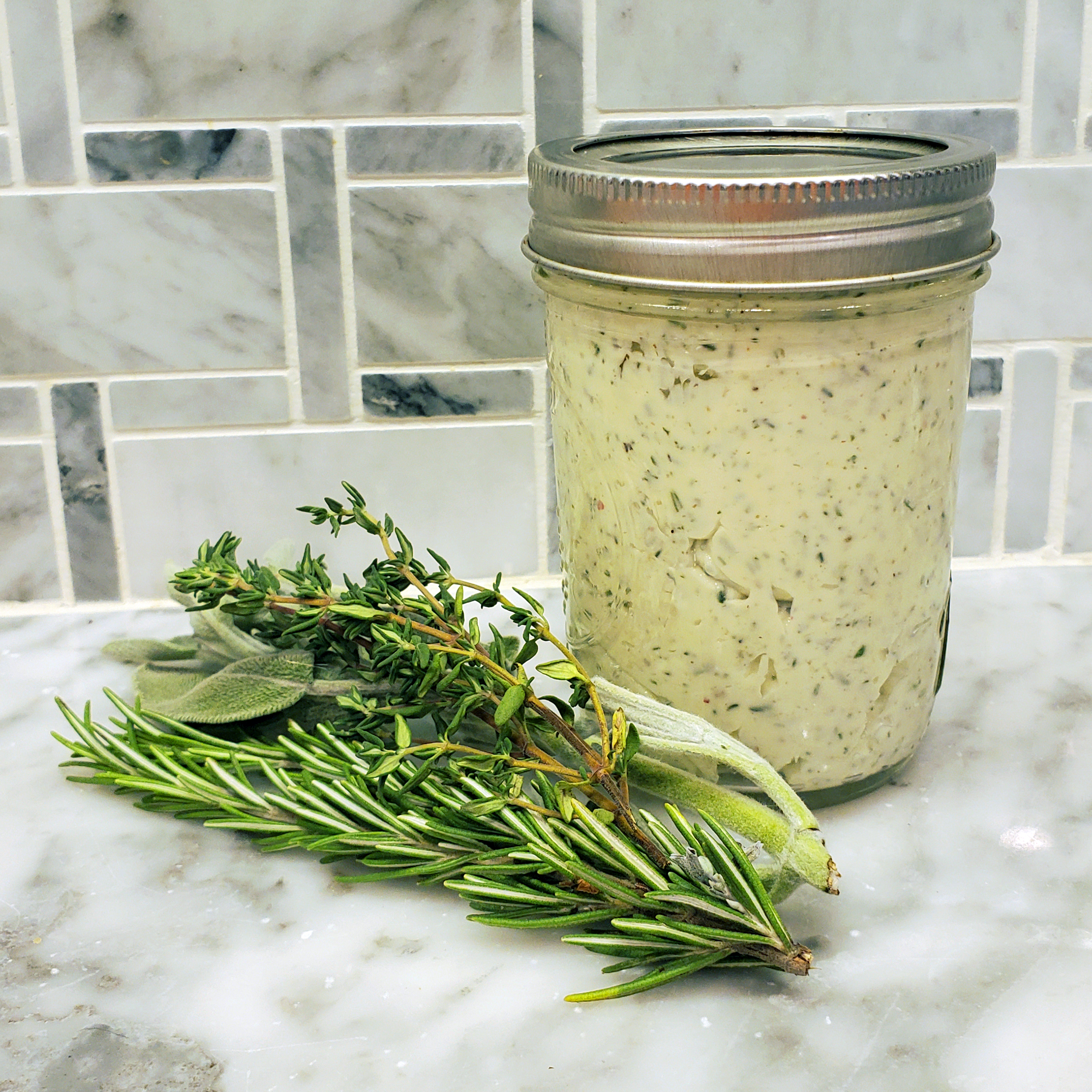 Herb compound butter made with fresh rosemary, thyme, sage, and garlic.