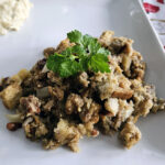 Golden baked cornbread stuffing served in a casserole dish, ready for the holiday table.