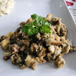 Golden baked cornbread stuffing served in a casserole dish, ready for the holiday table.