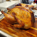 Fully roasted Thanksgiving turkey resting before carving to retain juices.