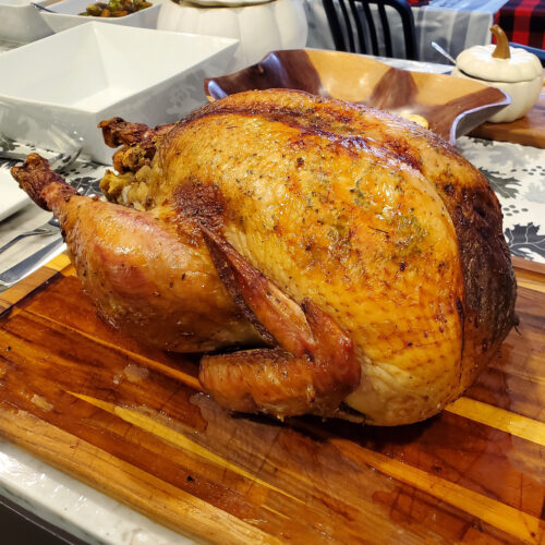 Fully roasted Thanksgiving turkey resting before carving to retain juices.