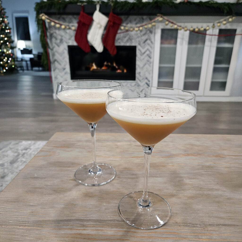 Silent Nightcap cocktail styled for winter with soft lighting and a cozy setting.