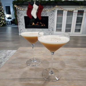 Silent Nightcap cocktail styled for winter with soft lighting and a cozy setting.