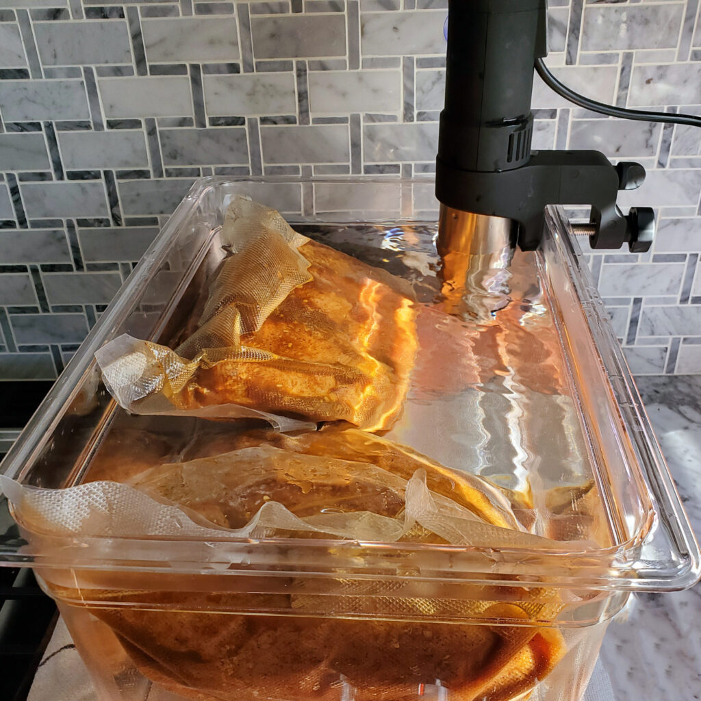 Smoked pork butt sealed in a vacuum bag before cooking sous vide.