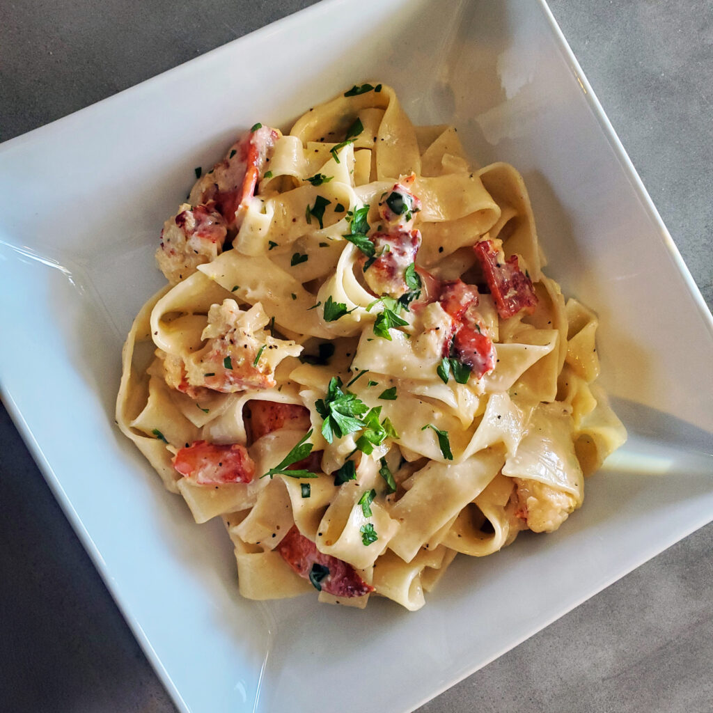 Homemade pasta served with a rich sauce, showing how noodles hold and carry sauce.