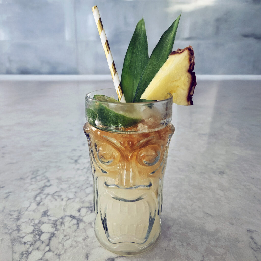 Mai Tai cocktail showing a layered dark rum float on top for a classic tiki presentation.