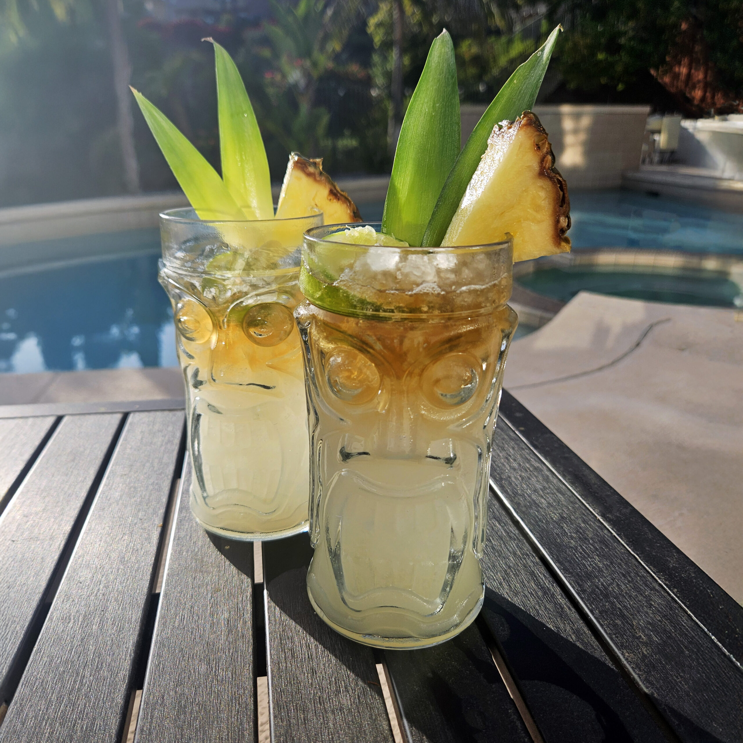 Mai Tai served in a decorative tiki glass with crushed ice and citrus garnish.
