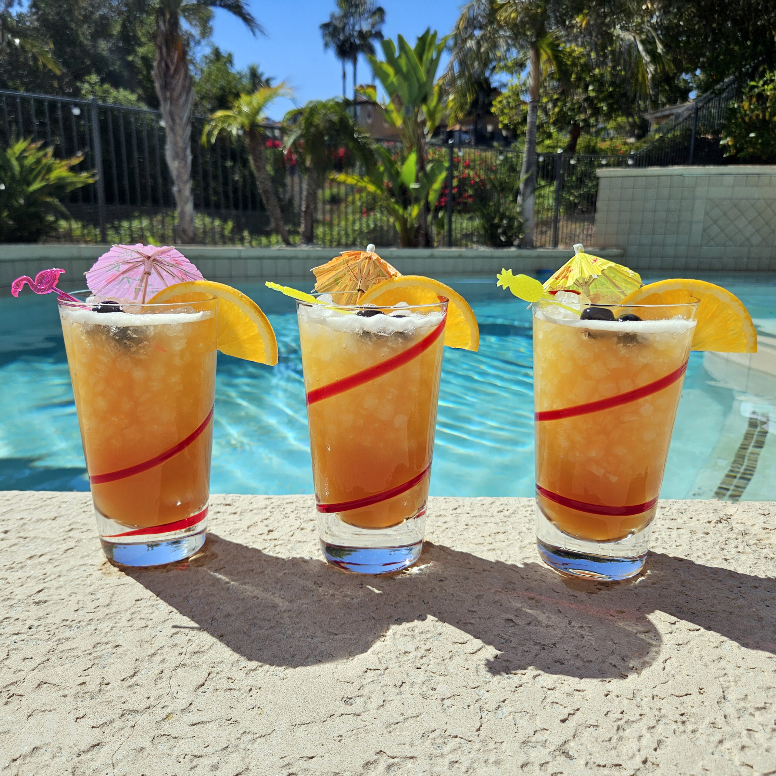 Rum punch cocktail served over nugget ice in a clear glass.